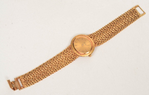Relógio feminino, da marca PIAGET, caixa e pulseira em ouro, mecanismo à corda, número de série 9331