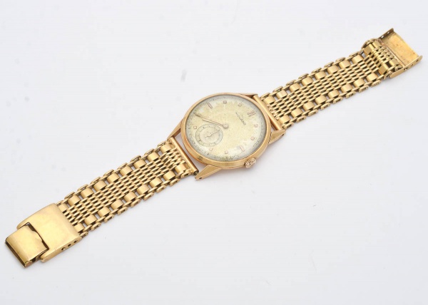 Relógio masculino, da marca  MOVADO, em ouro amarelo, 18k, peso bruto 71 gramas Comprimento (aberto)