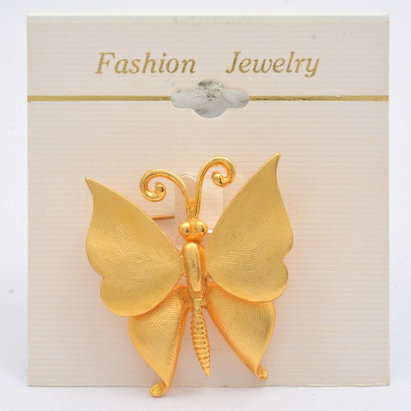 Arte . Broche de metal amarelo no formato de flor e esmalte na foto 5