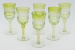 Seis goblets p/ licor estilo Luiz XVI, em cristal double verde lapidado e bizotado em frisos, alt. 15cm.
