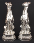 Cães Galgos, par de grandes esculturas provavelmente italianas estilo art deco, em marmorite espessurado a prata, alt. 48cm.