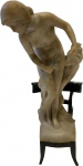 Antiga escultura Art Nouveau em mármore representando figura feminina sobre cadeira, apresenta selo, (apresenta pescoço restaurado). Med. 40 cm.