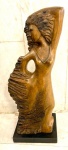 ANTONIO GOMIDE- Escultura em bronze patinado representando figura feminina, base em granito, peça assinada. Med. total 70 X 27 cm.