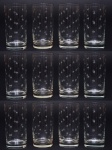 Doze copos para água em cristal translucido, decorado com estrelinhas lapidadas. Altura 14,5 cm.