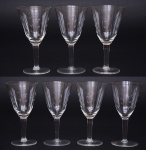 Sete taças para vinho em vidro translucido, decorado com lapidação. Altura 16 cm.