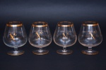 Quatro taças para conhaque em vidro, marca Napoleão  borda dourada. Altura 13 cm.
