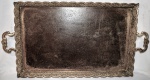 Antigo Tabuleiro em metal espessurado à prata. Com desgaste do banho. Década de 30. Med: 8 x 43 x 83 cm.