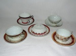 Lote constando cinco peças em porcelana nacional sendo quatro xícaras de chá e um mantegueira de diversos modelos e procedencias.