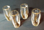 Lote constando de quatro copos para refresco em demi cristal translucido decorado por folhagens em ouro.